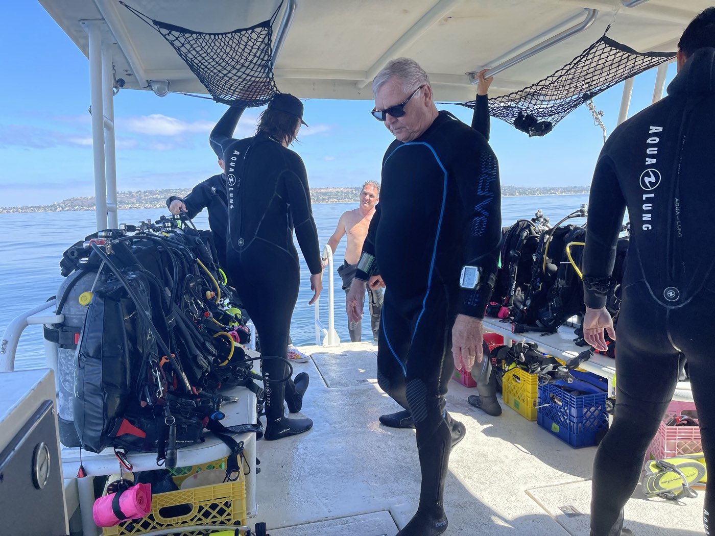 Divers gearing up on the Marissa's deck under the hardtop